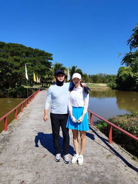 สนามกอล์ฟหริภุญชัย กอล์ฟคลับ 2 people people standing tree and body of water