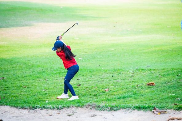 Alpinegolfresort Chiangmai 1 person playing a sport grass and golf course