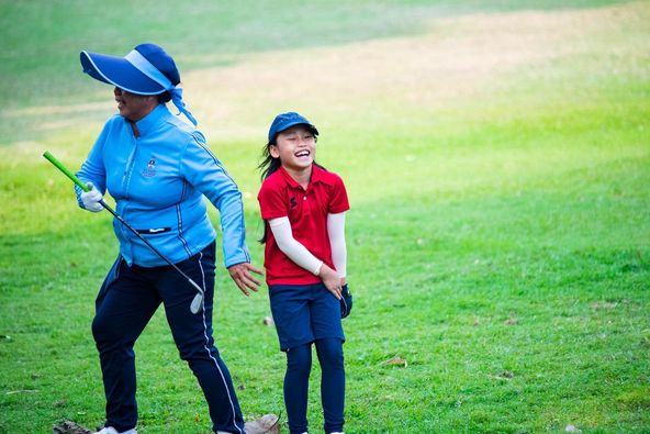 Alpinegolfresort Chiangmai 2 people people golfing and grass