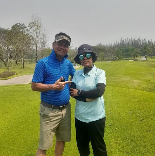 สนามกอล์ฟหริภุญชัย กอล์ฟคลับ 2 people people standing golf course and grass