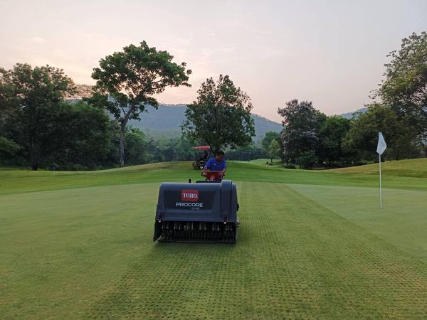Alpinegolfresort Chiangmai 1 person golfing golf cart golf course and text