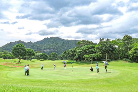 Khao Yai Country Club 7 people people golfing and golf course