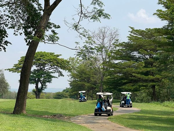 Mountain Creek Golf Resort And Residences 2 people people golfing golf cart and golf course