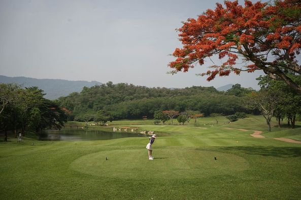 Khao Yai Country Club 1 person golfing and golf course