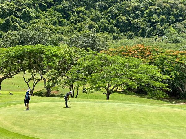 Khao Yai Country Club 2 people people golfing and golf course