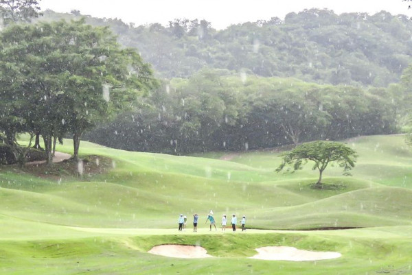 Khao Yai Country Club 7 people people golfing and golf course