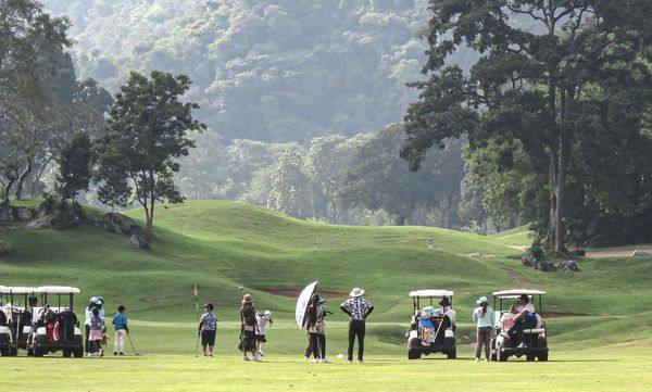 Khao Yai Country Club 13 people people golfing golf cart and golf course