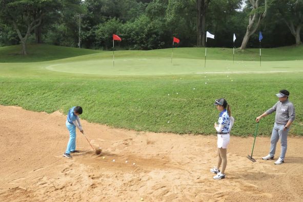 Khao Yai Country Club 3 people people golfing and golf course