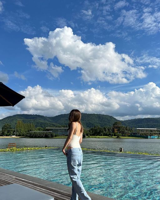 Kirimaya Khao Yai 1 person standing mountain cloud and pool