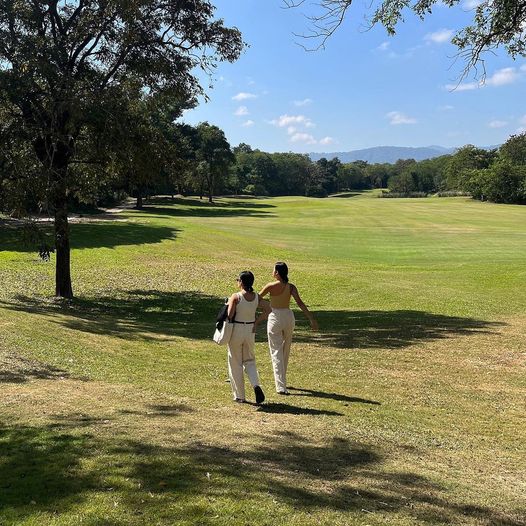 Kirimaya Khao Yai 2 people people standing golf course grass and tree