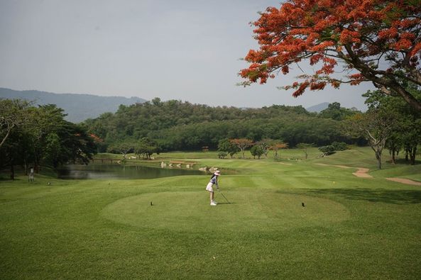 Khao Yai Country Club 1 person golfing and golf course