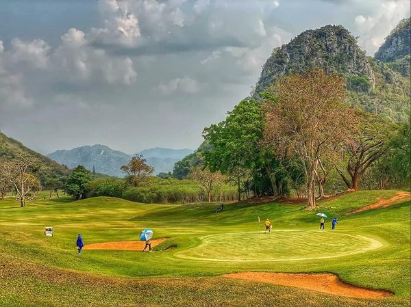 Khao Yai Country Club 4 people people golfing and golf course