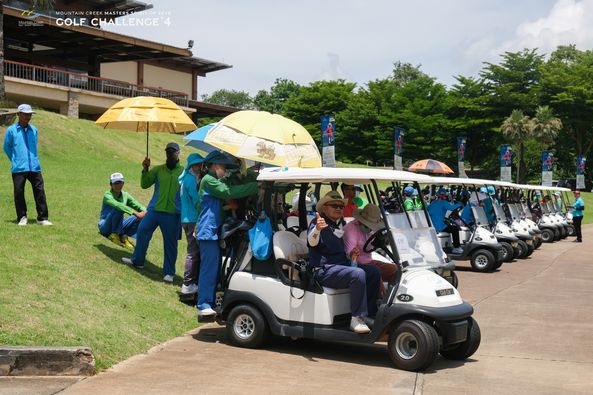 Mountain Creek Golf Resort And Residences 8 people people golfing golf cart golf course and text