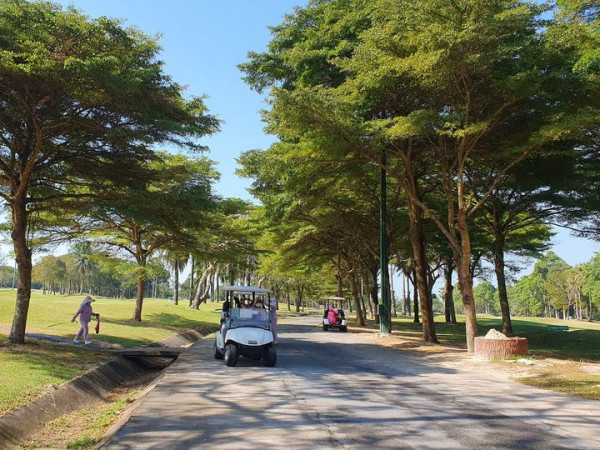 Rayong Green Valley Golf 3 people sky tree and road