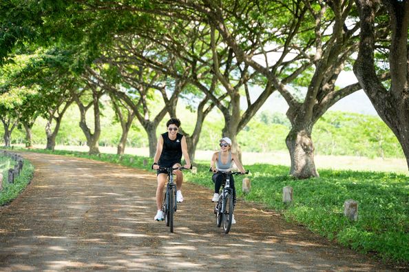 Chatrium Golf Resort Soi Dao Chanthaburi 2 people people standing bicycle road and tree