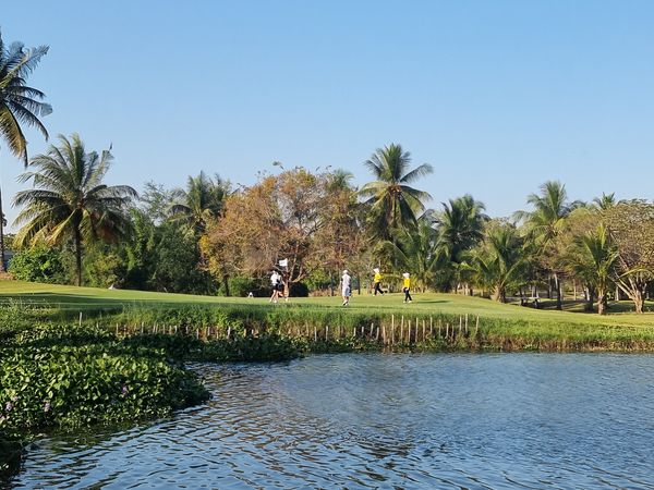 Eastern Star Country Club amp Resort 5 people grass nature body of water and tree