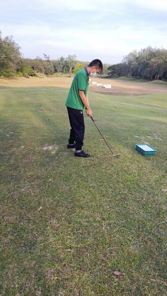 Wangjuntr Golf Park 1 person and grass