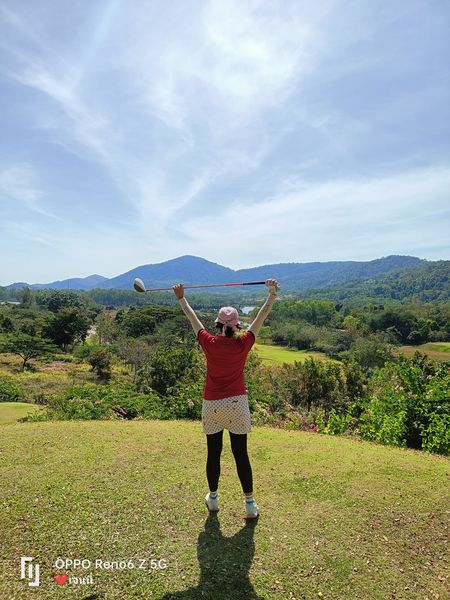 Wangjuntr Golf Park 1 person standing mountain cloud and tree