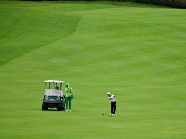 Amata Spring Country Club 2 people grass and nature