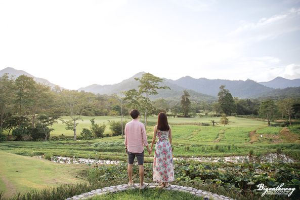 Chatrium Golf Resort Soi Dao Chanthaburi 2 people people standing flower and grass