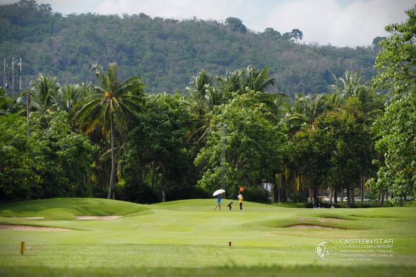 Eastern Star Country Club amp Resort 2 people grass golf course and nature