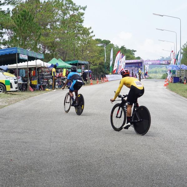 Chatrium Golf Resort Soi Dao Chanthaburi 4 people bicycle road and text