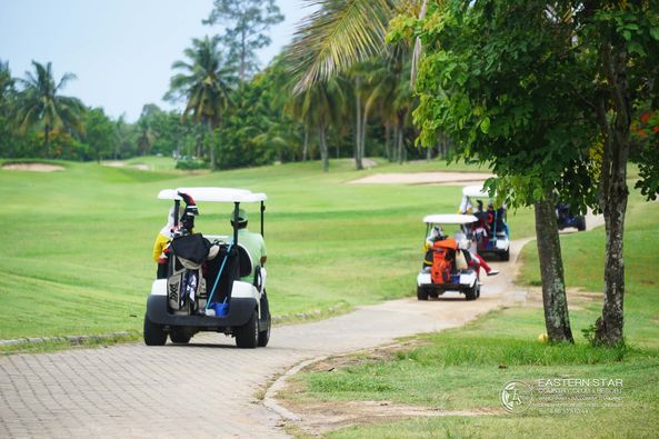 Eastern Star Country Club amp Resort 1 person golfing golf cart golf course and text