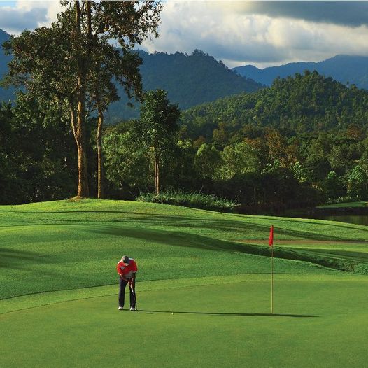 Chatrium Golf Resort Soi Dao Chanthaburi 1 person golfing and golf course