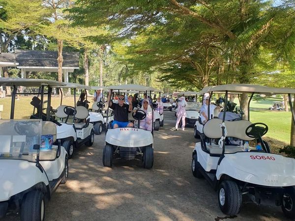 5 people golf cart and outdoors