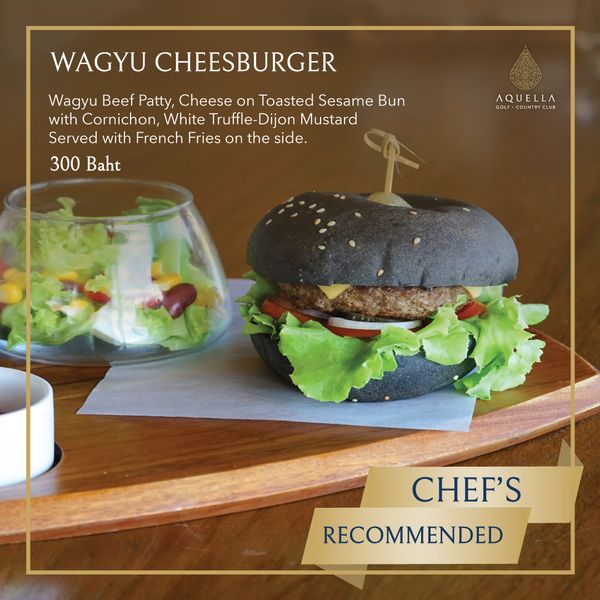 Aquella Golf amp Country Club burger and WAGY CHEESBURGER Wagyu Beef Patty Cheese on Toasted Sesame Bun with Cornichon White Truffle Dijon Mustard Served with French Fries on the side 300 Baht AQUELLA co OUNT CLUB CHEF S RECOMMENDED