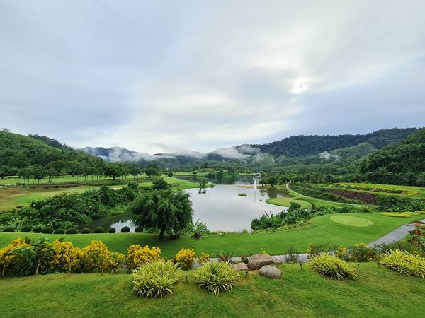 Katathong Golf Resort amp Spa lake mountain cloud golf course and grass