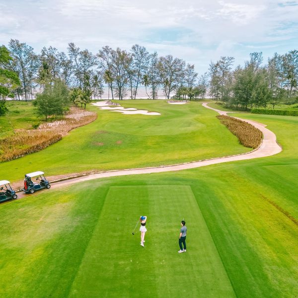 Aquella Golf amp Country Club 2 people people golfing golf cart and golf course